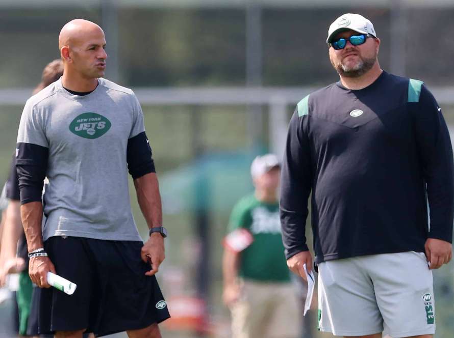 Head coach Robert Saleh, left, of the New York Jets talks with general manager Joe Douglas during morning practice at Atlantic Health Jets Training Center on July 28, 2021 in Florham Park, New Jersey.