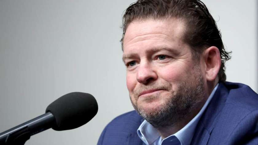 RENTON, WASHINGTON - FEBRUARY 01: John Schneider, general manager of the Seattle Seahawks, reacts as he announces Mike Macdonald as the new Seattle Seahawks head coach at Virginia Mason Athletic Center on February 01, 2024 in Renton, Washington.