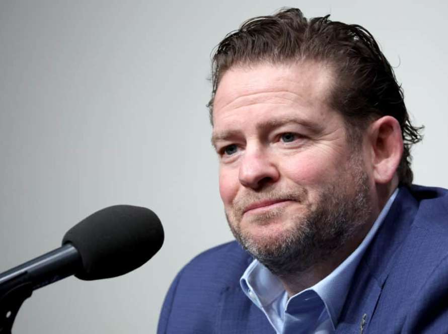 RENTON, WASHINGTON - FEBRUARY 01: John Schneider, general manager of the Seattle Seahawks, reacts as he announces Mike Macdonald as the new Seattle Seahawks head coach at Virginia Mason Athletic Center on February 01, 2024 in Renton, Washington.