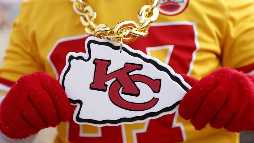 KANSAS CITY, MISSOURI - JANUARY 29: A detailed view of the Kansas City Chiefs logo on a fan prior to the AFC Championship Game against the Cincinnati Bengals at GEHA Field at Arrowhead Stadium on January 29, 2023 in Kansas City, Missouri.