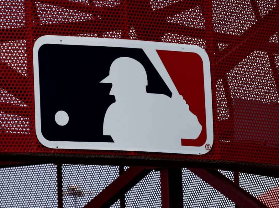 A MLB logo is seen before a game between the Oakland Athletics and the Los Angeles Angels at Angel Stadium of Anaheim on May 22, 2022 in Anaheim, California.