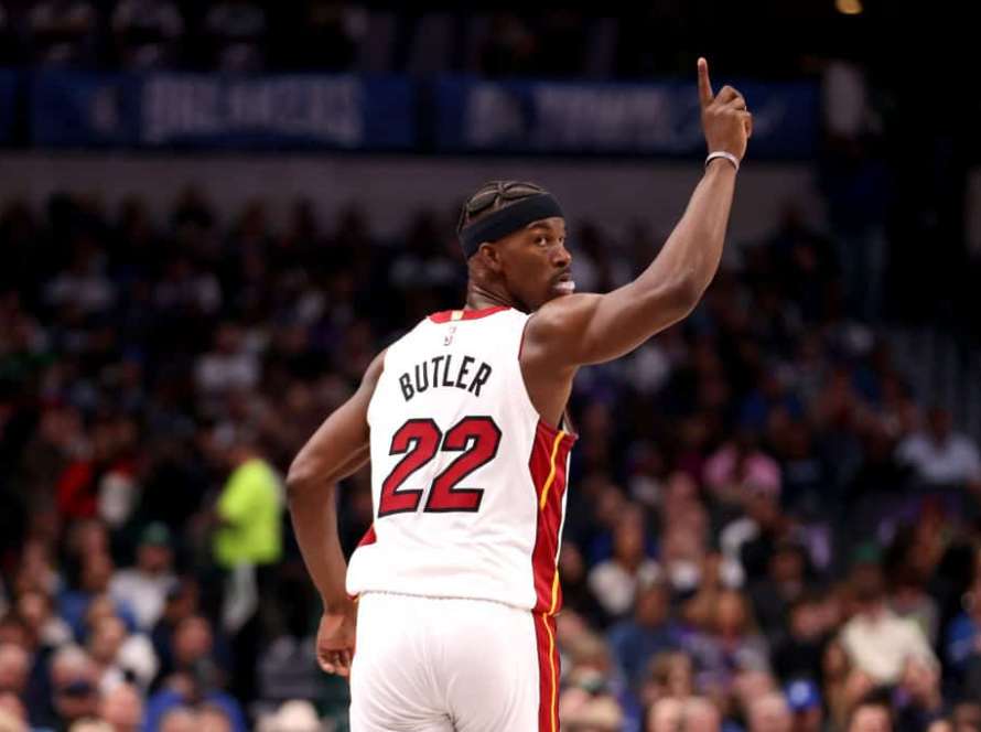 Jimmy Butler #22 of the Miami Heat celebrates making a basket against the Dallas Mavericks in the first half at American Airlines Center on March 07, 2024 in Dallas, Texas.