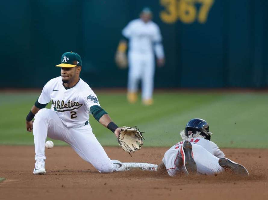 Jarren Duran #16 of the Boston Red Sox steals second base ahead of Darell Hernaiz #2 of the Oakland Athletics in the top of the first inning at Oakland Coliseum on April 01, 2024 in Oakland, California.
