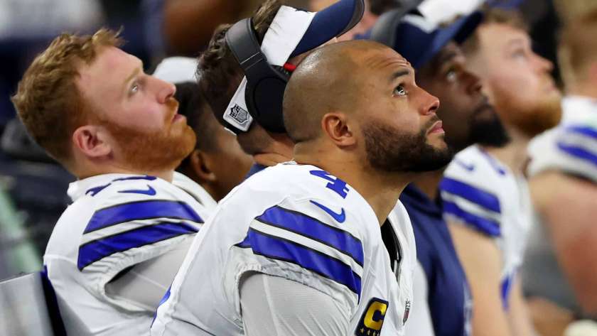 ARLINGTON, TEXAS - JANUARY 14: Dak Prescott #4 of the Dallas Cowboys looks on from the bench during the NFC Wild Card Playoff game against the Green Bay Packers at AT&T Stadium on January 14, 2024 in Arlington, Texas.