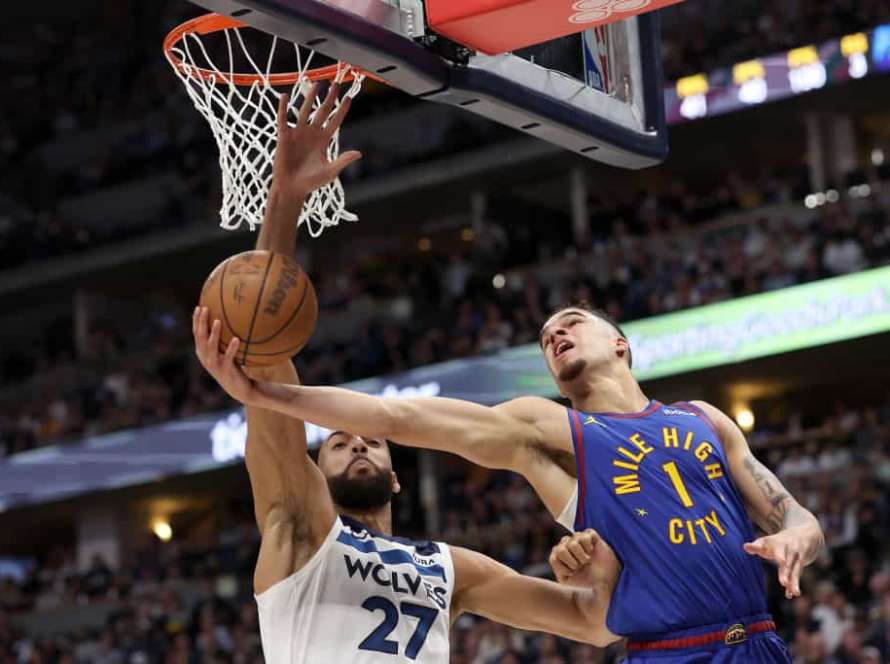 Michael Porter Jr. #1 of the Denver Nuggets goes to the basket against Rudy Gobert #27 of the Minnesota Timberwolves in the first quarter during Game One of the Western Conference Second Round Playoffs at Ball Arena on May 04, 2024 in Denver, Colorado.