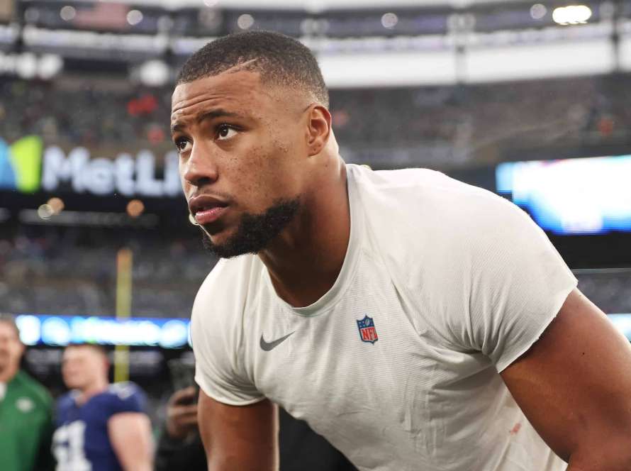 EAST RUTHERFORD, NEW JERSEY - OCTOBER 29: Saquon Barkley #26 of the New York Giants looks on after his team's 13-10 overtime loss against the New York Jets at MetLife Stadium on October 29, 2023 in East Rutherford, New Jersey.