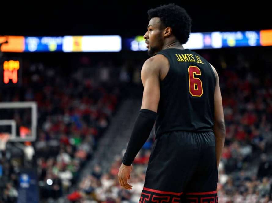 Bronny James #6 of the USC Trojans looks onin the second half of a quarterfinal game against the Arizona Wildcats during the Pac-12 Conference basketball tournament at T-Mobile Arena on March 14, 2024 in Las Vegas, Nevada. The Wildcats defeated the Trojans 70-49.