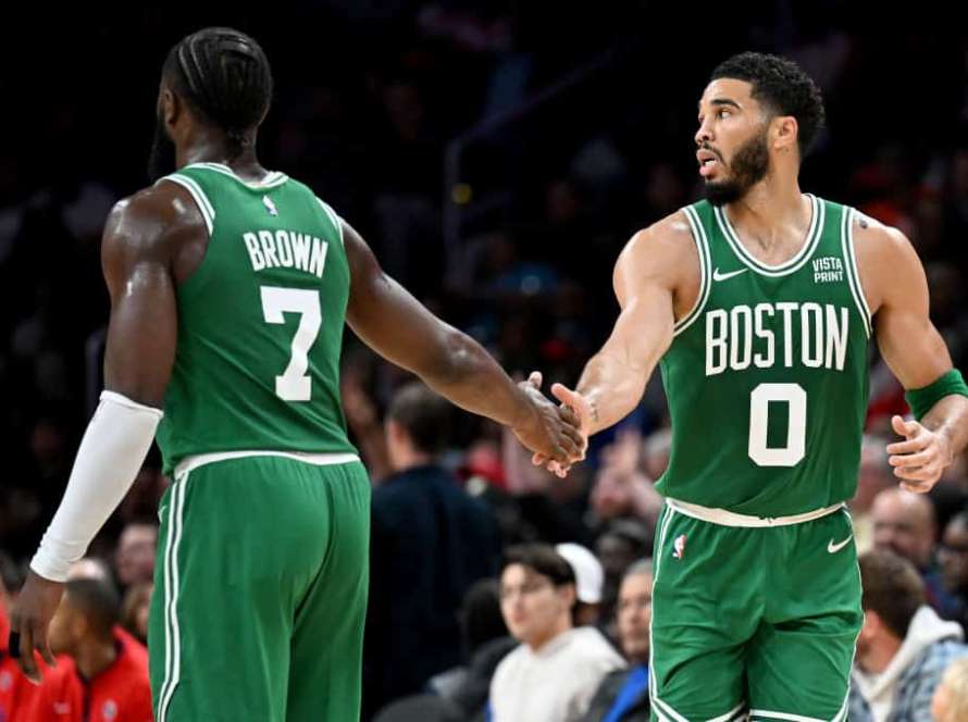 Jayson Tatum #0 of the Boston Celtics celebrates with Jaylen Brown #7 in the third quarter against the Washington Wizards at Capital One Arena on October 30, 2023 in Washington, DC.