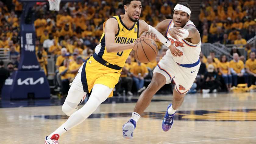 INDIANAPOLIS, INDIANA - MAY 17: Tyrese Haliburton #0 of the Indiana Pacers dribbles the ball against Miles McBride #2 of the New York Knicks during the third quarter in Game Six of the Eastern Conference Second Round Playoffs at Gainbridge Fieldhouse on May 17, 2024 in Indianapolis, Indiana. NOTE TO USER: User expressly acknowledges and agrees that, by downloading and or using this photograph, User is consenting to the terms and conditions of the Getty Images License Agreement.