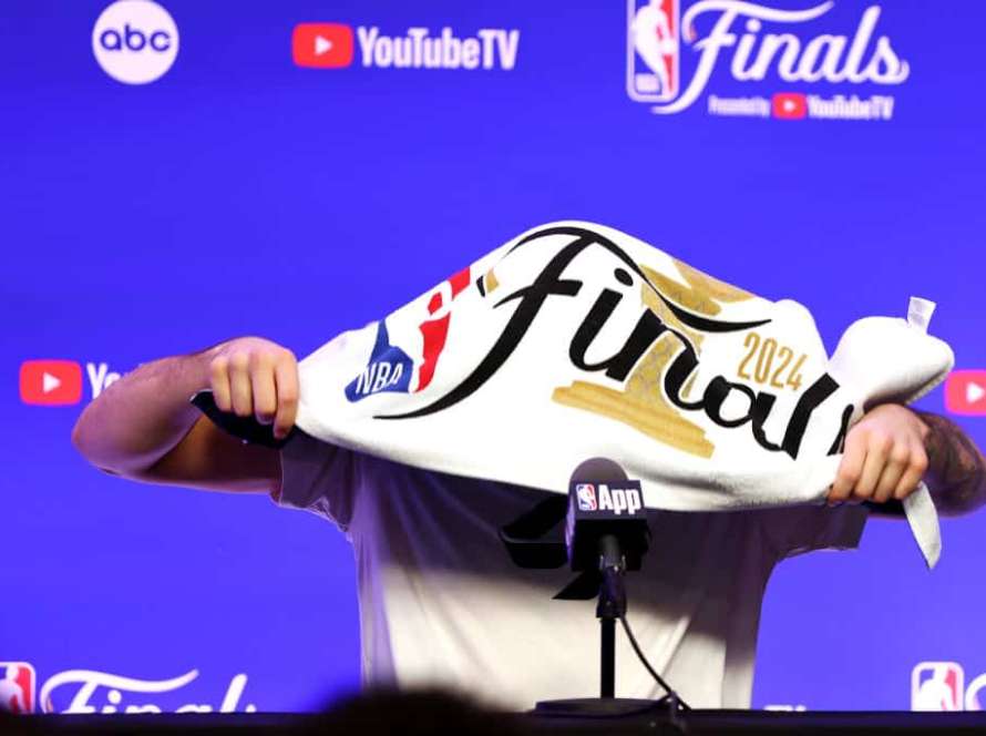 Luka Doncic #77 of the Dallas Mavericks drapes a towel over his head before speaking to media during the 2024 NBA Finals Media Day at TD Garden on June 05, 2024 in Boston, Massachusetts.