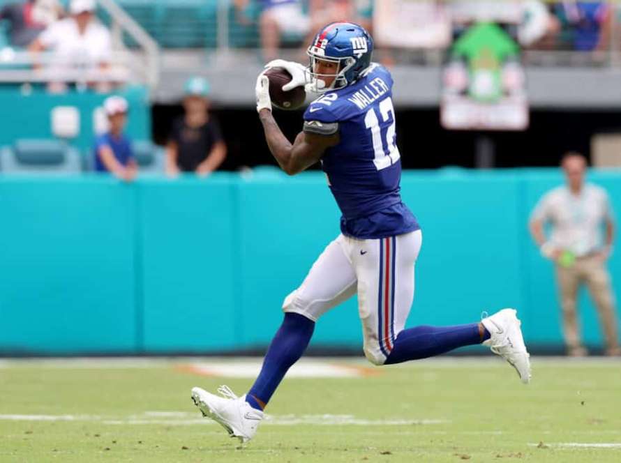 MIAMI GARDENS, FLORIDA - OCTOBER 08: Darren Waller #12 of the New York Giants makes a catch against the Miami Dolphins during the second half at Hard Rock Stadium on October 08, 2023 in Miami Gardens, Florida.