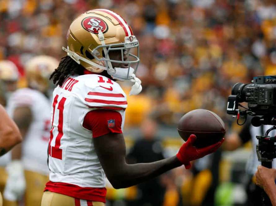 Brandon Aiyuk #11 of the San Francisco 49ers reacts after catching a touchdown in the first quarter against the Pittsburgh Steelers at Acrisure Stadium on September 10, 2023 in Pittsburgh, Pennsylvania.