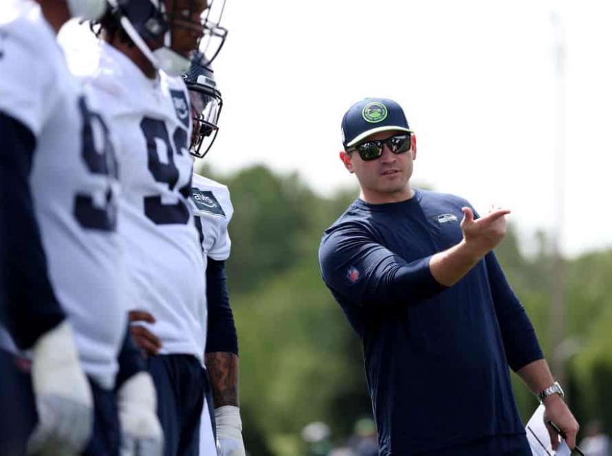 Head coach Mike Macdonald of the Seattle Seahawks watches a workout during Seattle Seahawks rookie minicamp at Virginia Mason Athletic Center on May 03, 2024 in Renton, Washington.