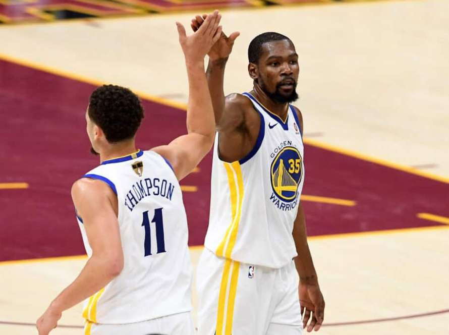 CLEVELAND, OH - JUNE 08: Klay Thompson #11 and Kevin Durant #35 of the Golden State Warriors react after a play in the second half against the Cleveland Cavaliers during Game Four of the 2018 NBA Finals at Quicken Loans Arena on June 8, 2018 in Cleveland, Ohio. NOTE TO USER: User expressly acknowledges and agrees that, by downloading and or using this photograph, User is consenting to the terms and conditions of the Getty Images License Agreement.