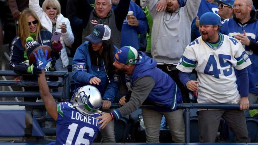 SEATTLE, WASHINGTON - OCTOBER 29: Tyler Lockett #16 of the Seattle Seahawks celebrates his touchdown catch with fans during the first quarter against the Cleveland Browns at Lumen Field on October 29, 2023 in Seattle, Washington.