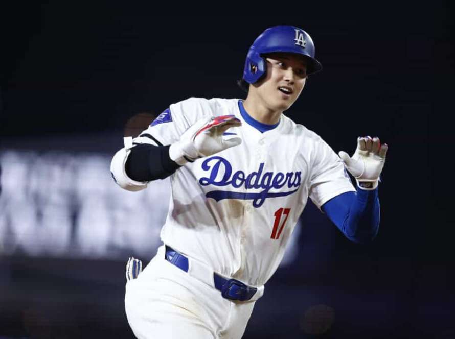 LOS ANGELES, CALIFORNIA - JULY 02: Shohei Ohtani #17 of the Los Angeles Dodgers hits a two-run home run against the Arizona Diamondback in the seventh inning at Dodger Stadium on July 02, 2024 in Los Angeles, California.